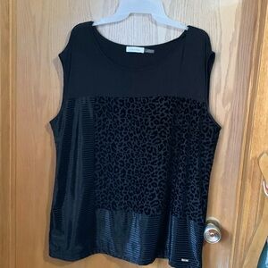 Sleeveless top - interesting textures and design - very flattering on